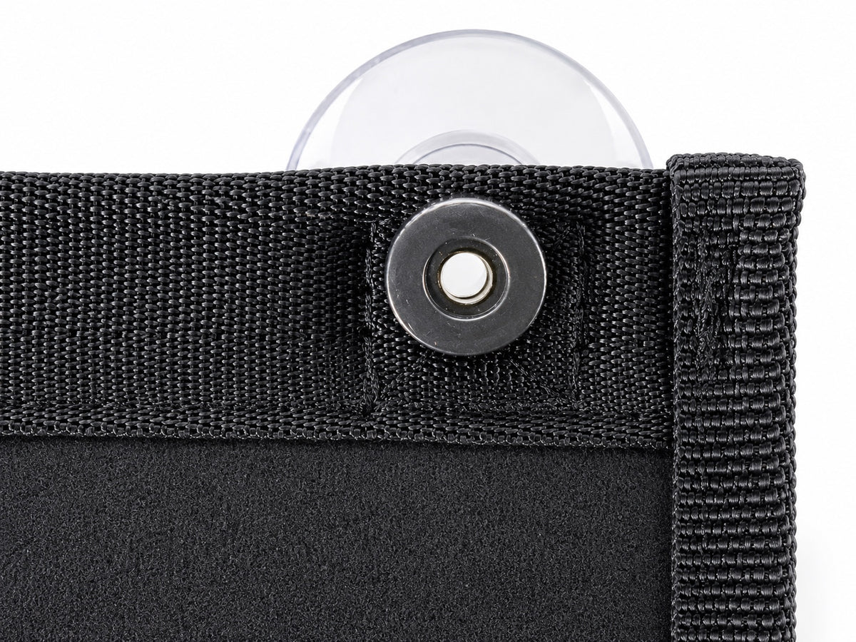 Close-up of the VDPS threaded mounting point on black seatbelt-grade webbing