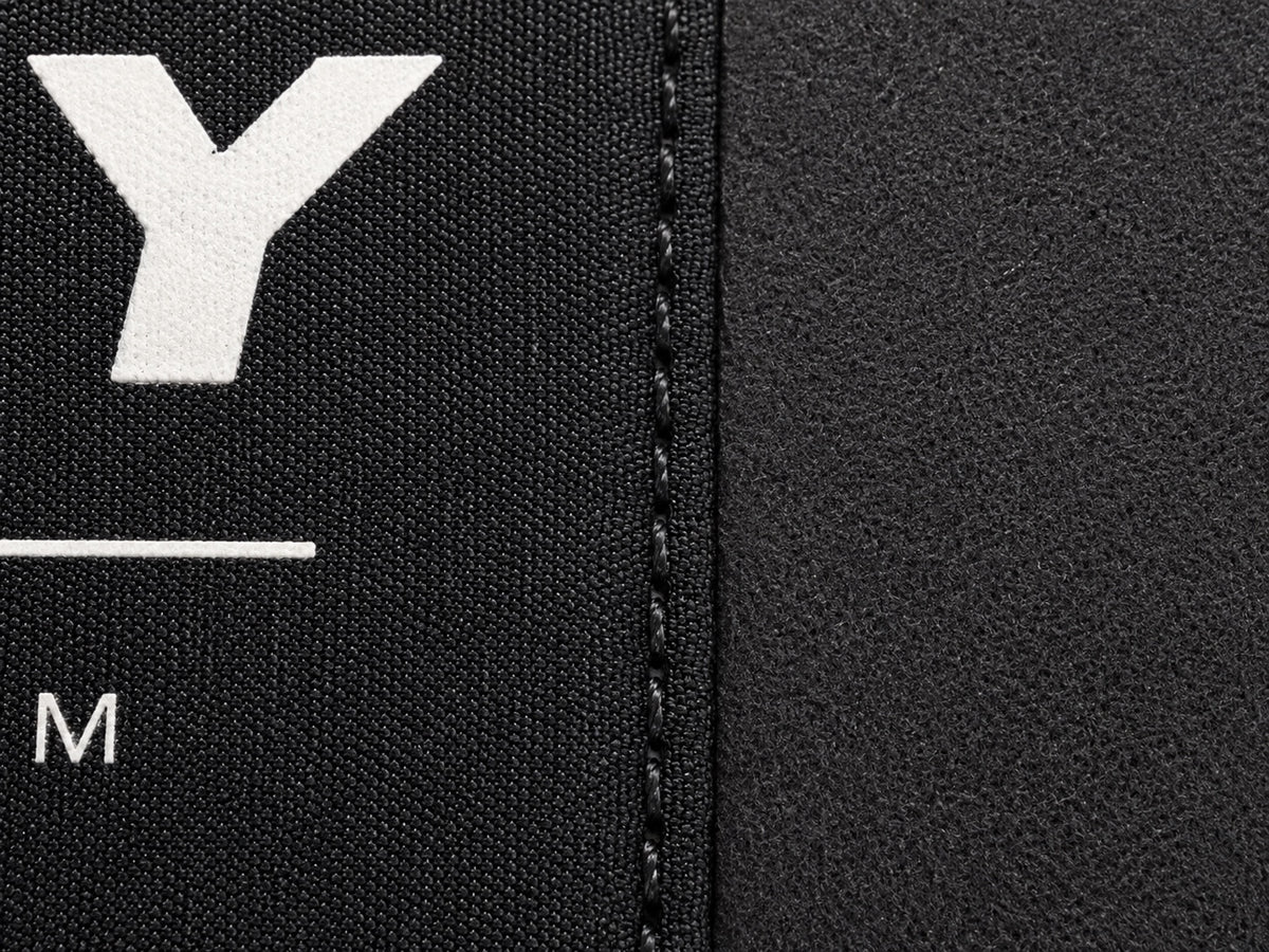 Macro view of the VDPS soft-touch automotive polyester and stitched label